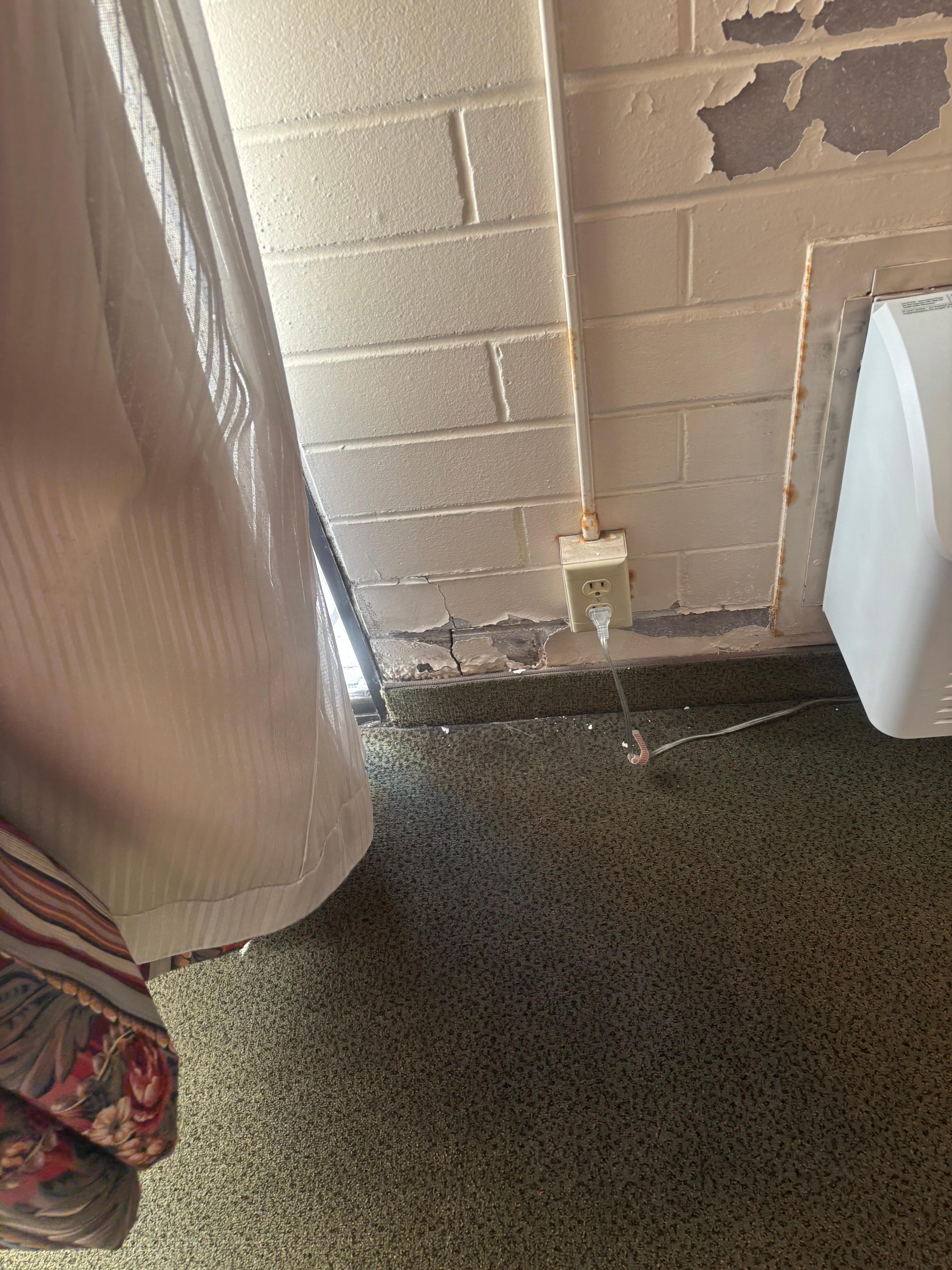 Damaged terrace door & outlet space.