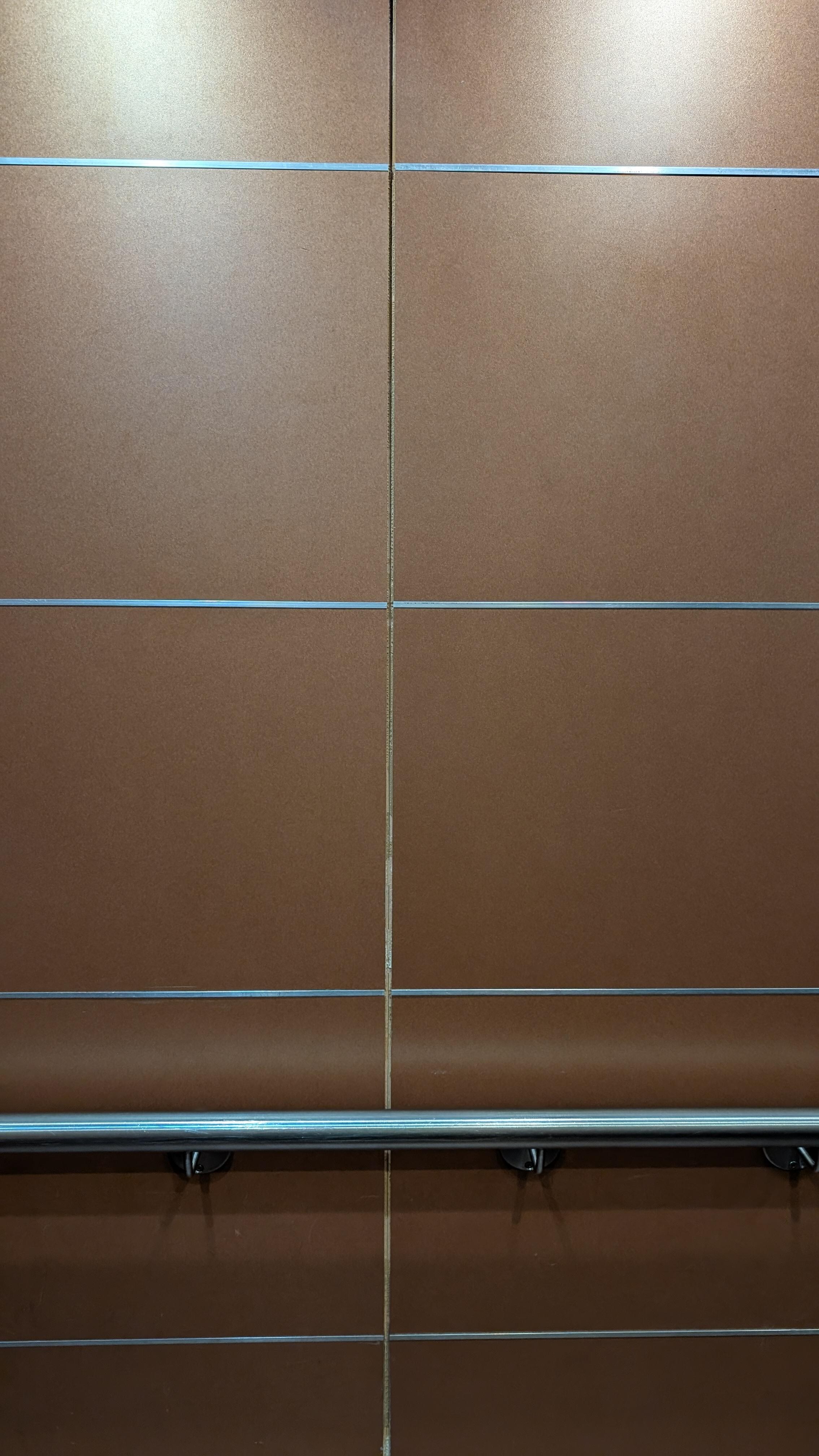 Damaged inside of the elevator. 