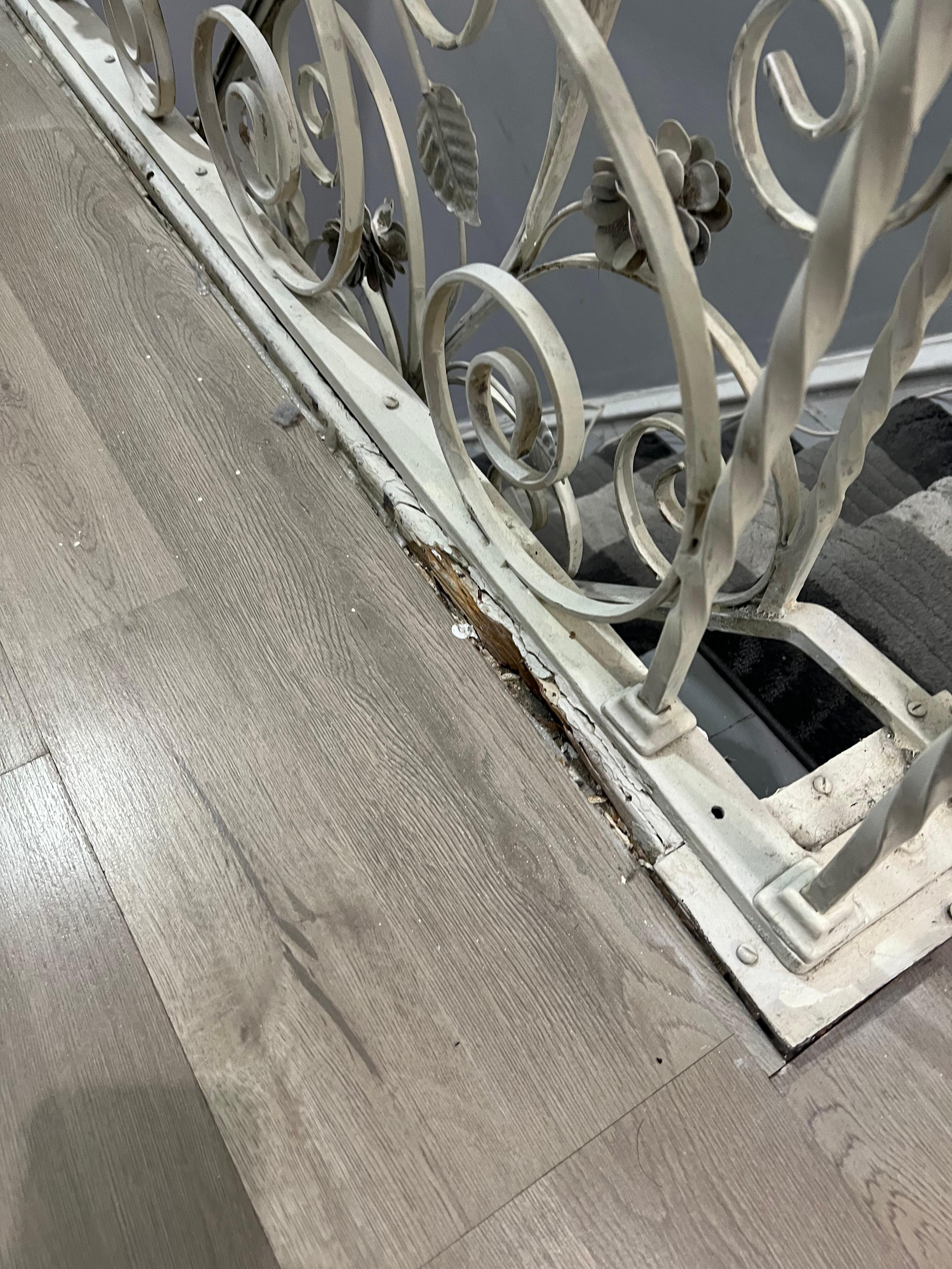 The chair rail is literally rotting away through the floor.