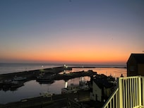 Dawn breaking over the harbour - the view from our room