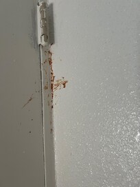 Corner of a wall by the bed