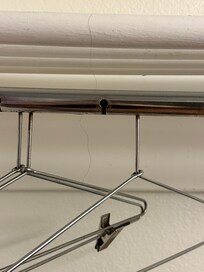 Hair hanging from the “closet”.