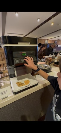 Rice dispensing machine at hotel breakfast buffet