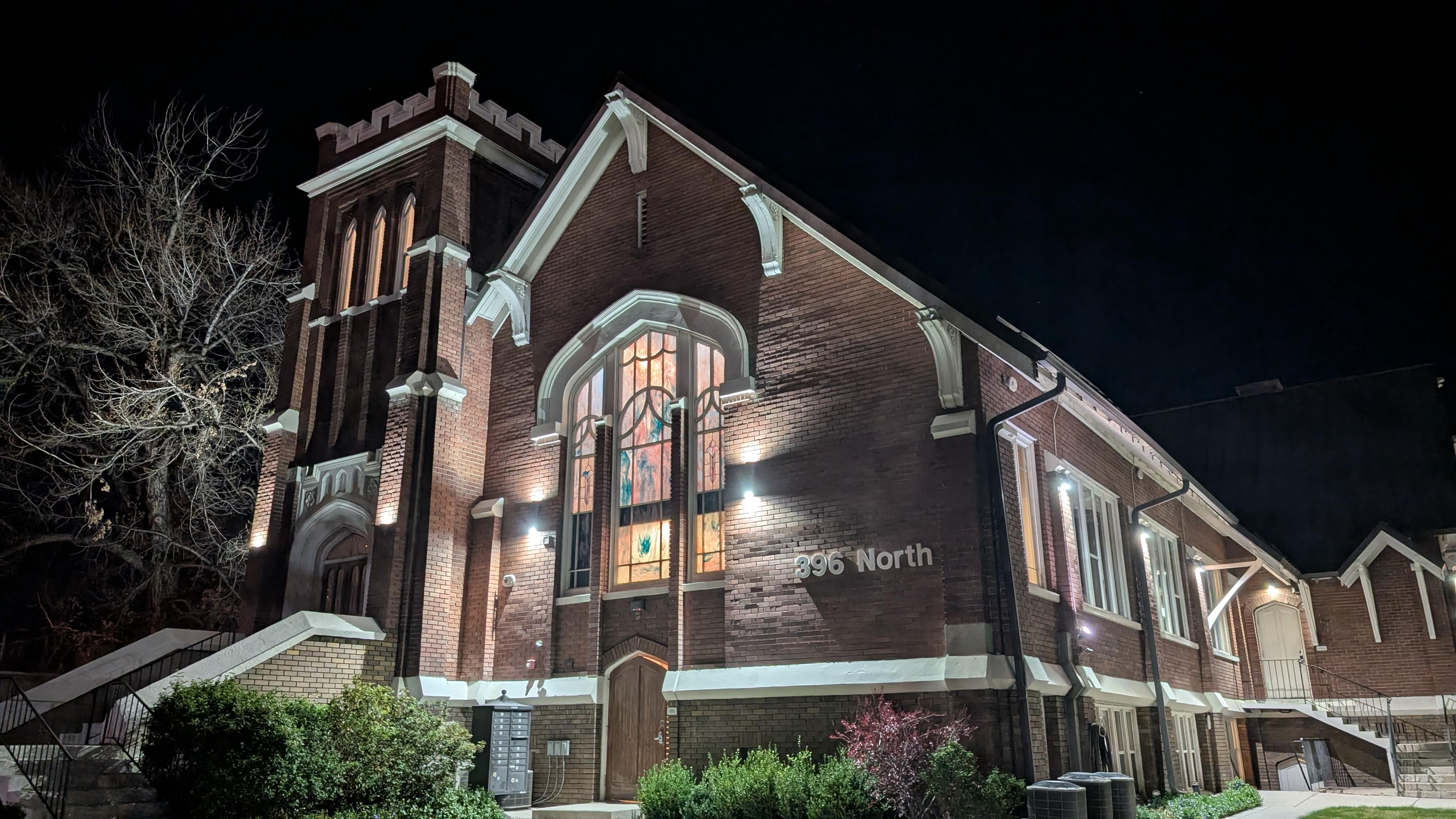 The apartment is behind the stained glass window, with the bedroom in the bell tower.