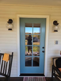 Door to the porch, which is huge and comfortable