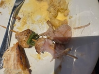 Raw chicken skewers from buffet