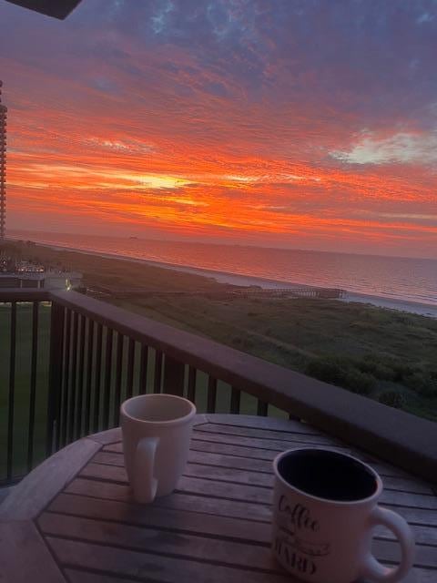 Morning coffee watching the sunrise.