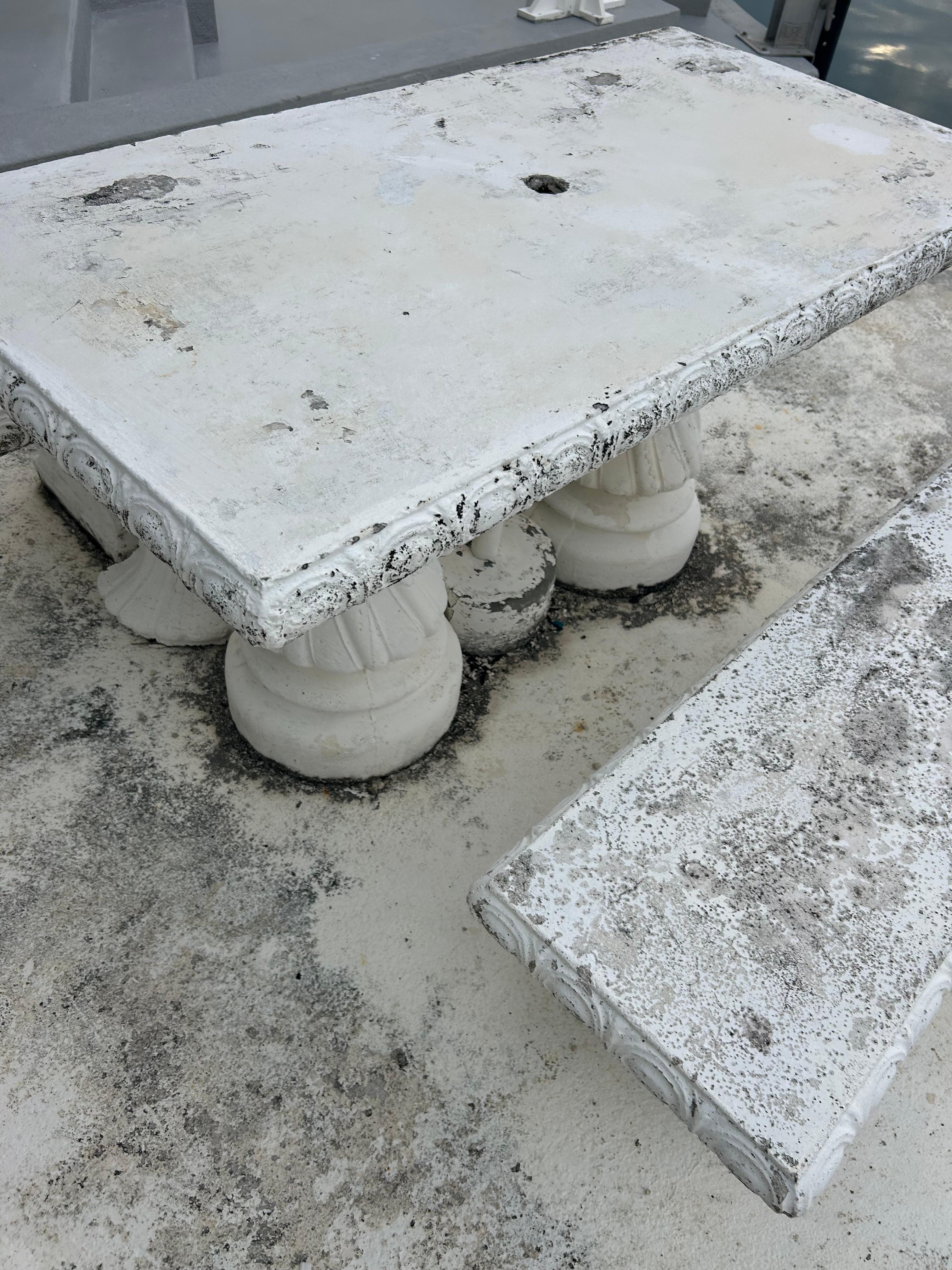 Heavy concrete table. Old and crumbling.