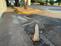 Steel rebar stickin up in parking lot