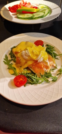 Egg benedict with hollandaise sauce and salmon