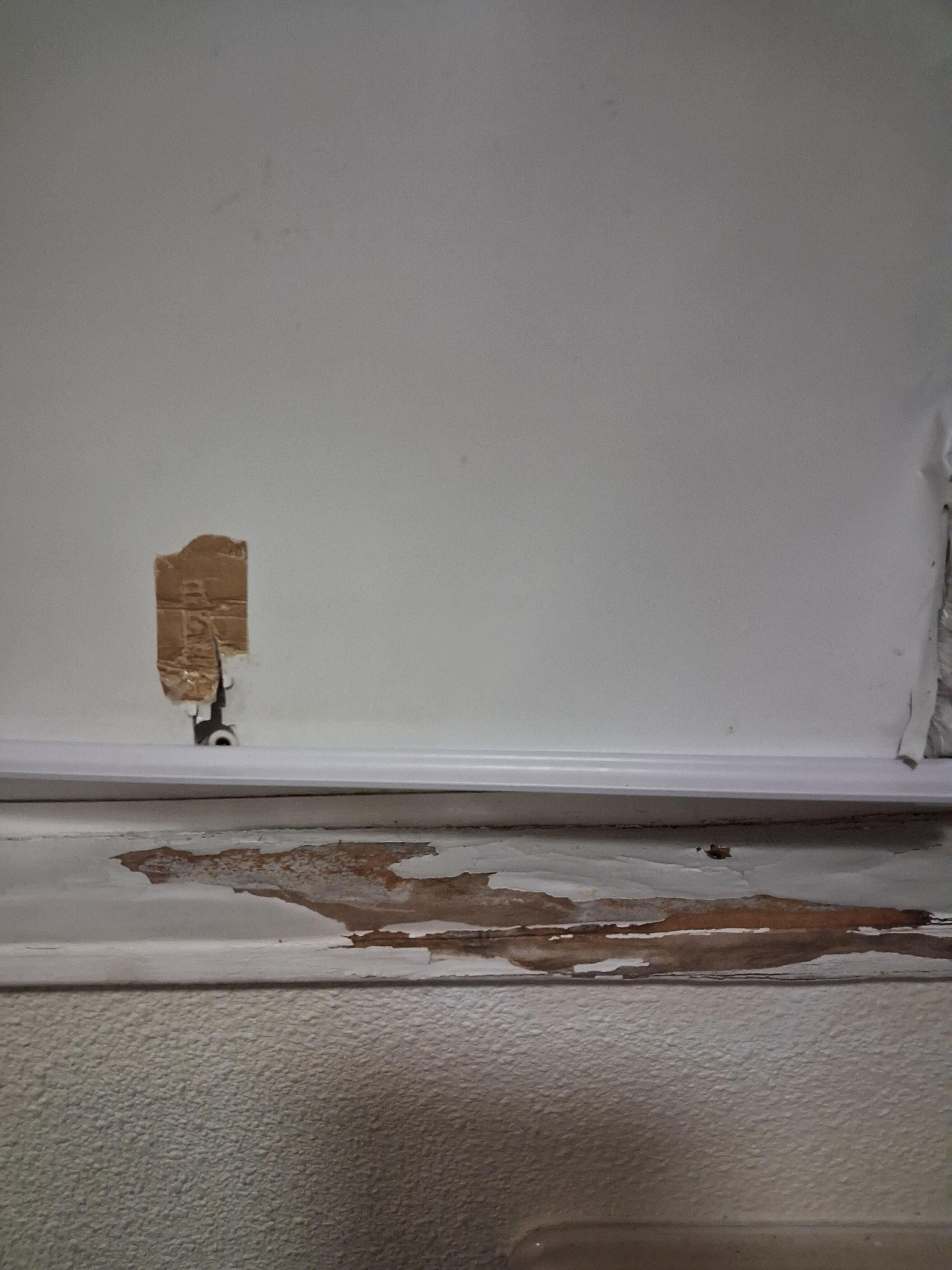 That's the window blind ripped and windowsill smashed