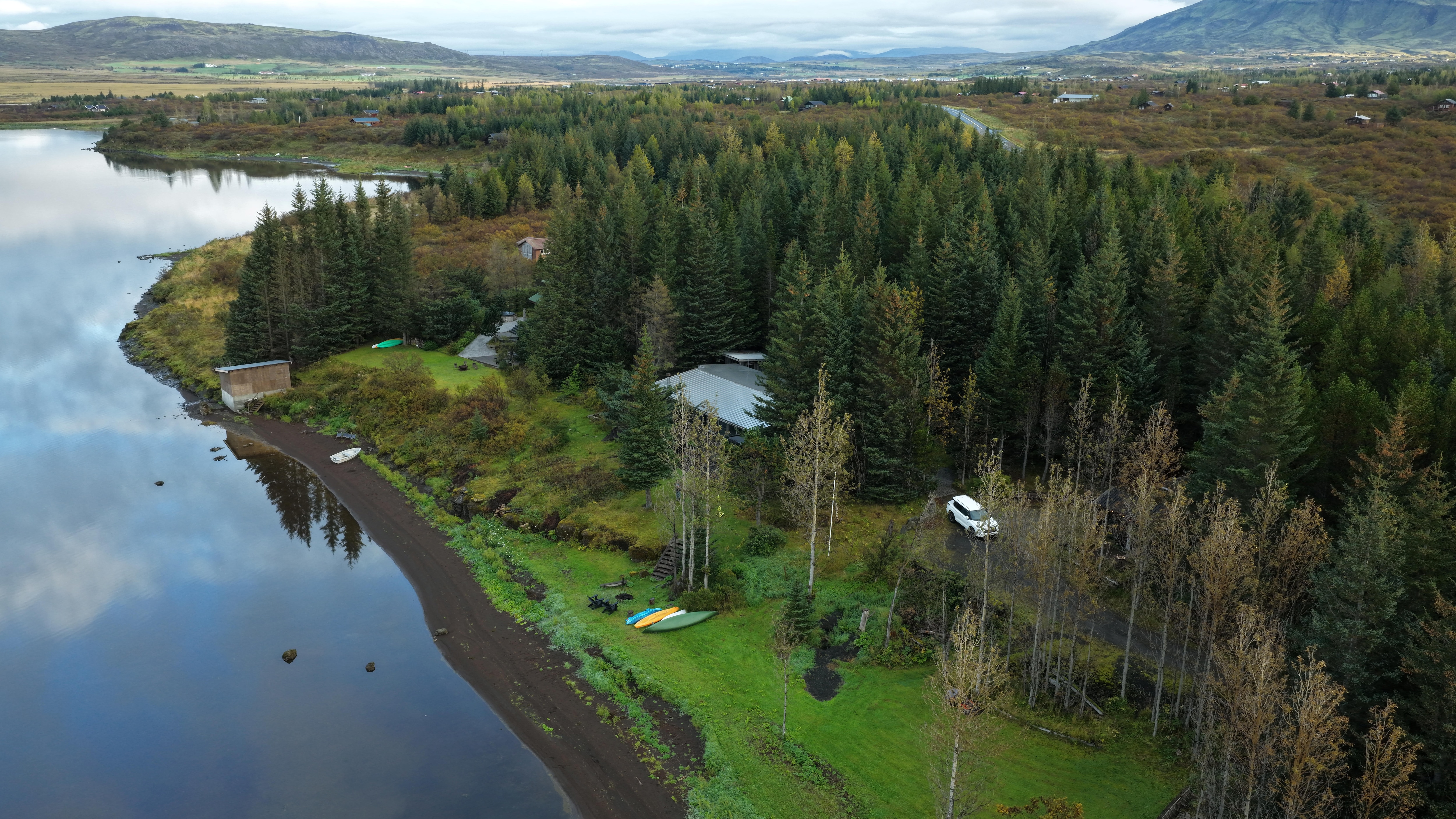 Drone shot of back of house, beach and surrounding area