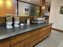 There was no bread. No muffins, no milk. The old orange juice was settling in the bottom of the machine. Where someone might have overflowed it.