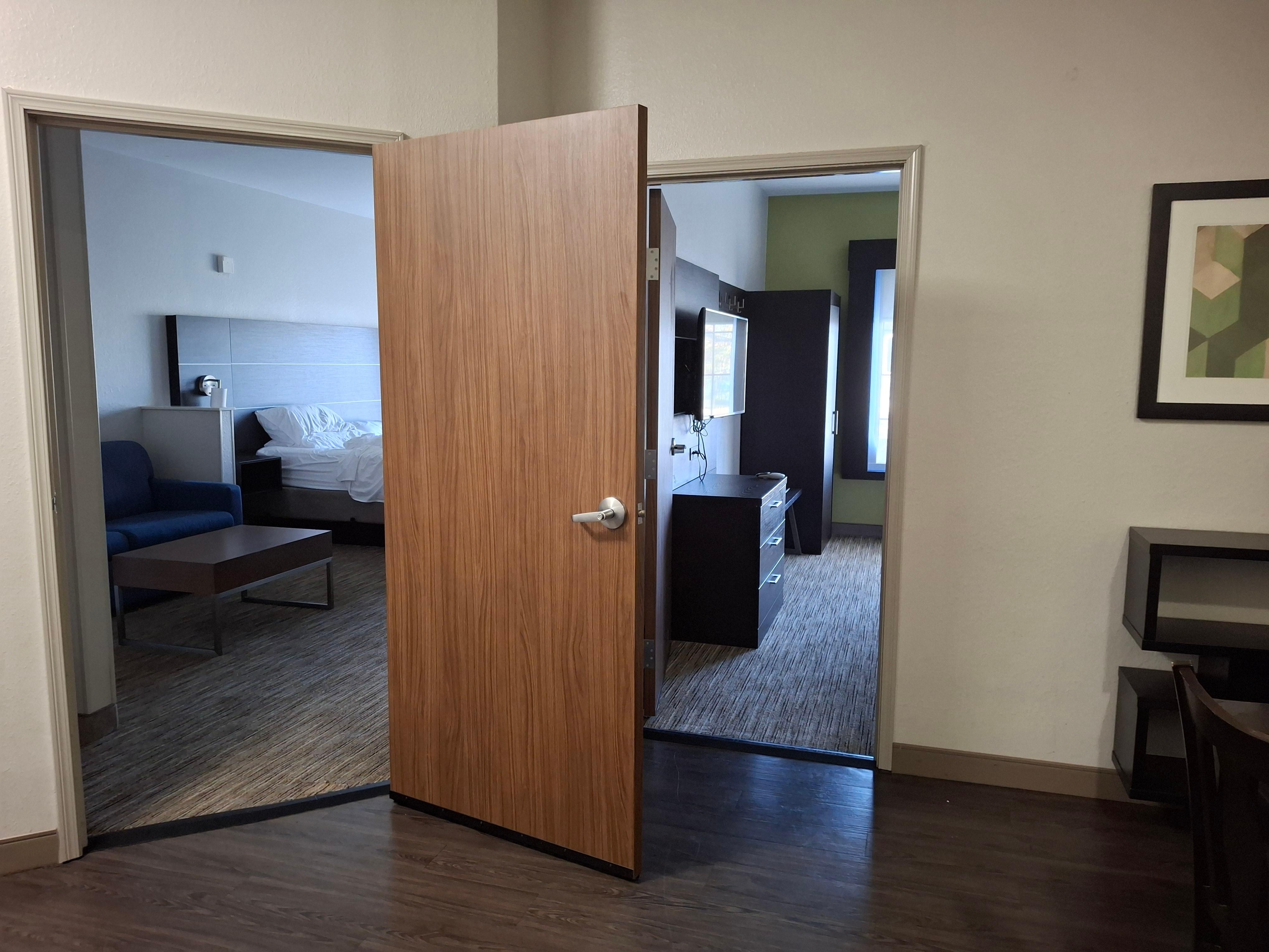 1 bedroom suite is actually a 2-bedroom, each with a door connecting to the central entry with table, microwave, coffee maker (no tv & sparse decorations)