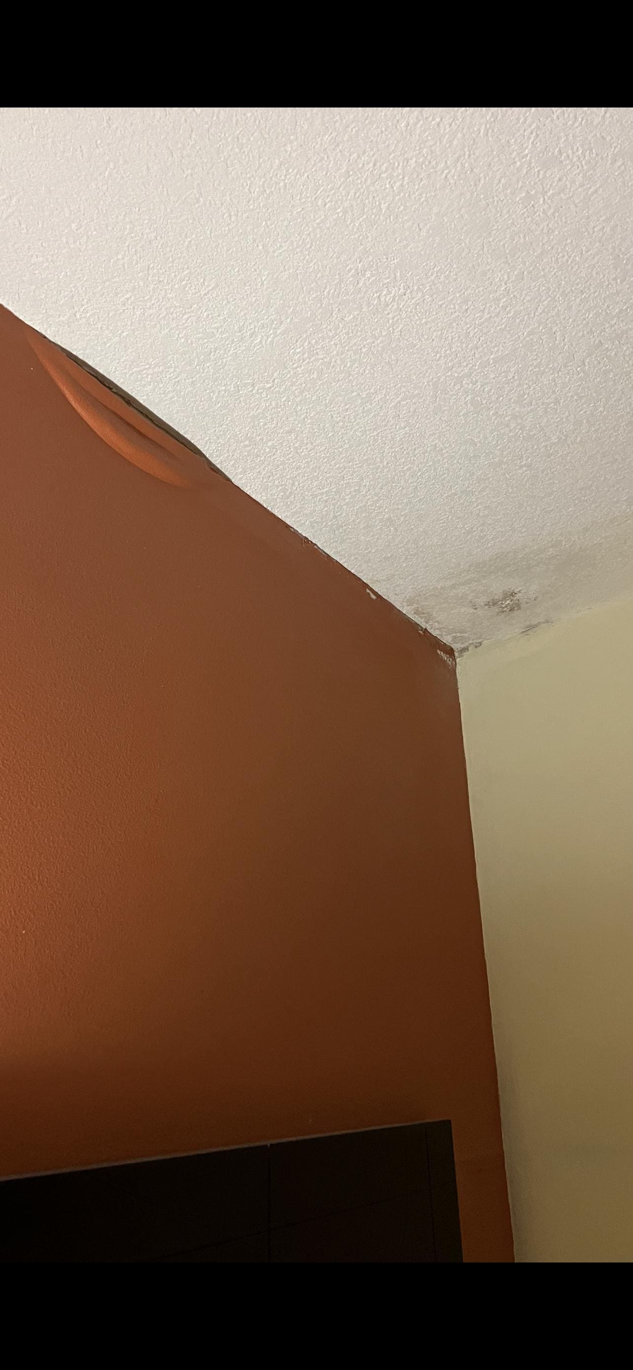 Water damage above one of the beds.