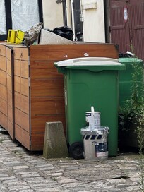 Garbage piling up in the courtyard smells, and the only operable window looks right the garbage bins.