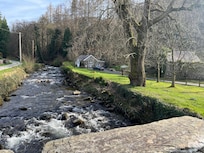 The cottage from bridge over Gwynant river.