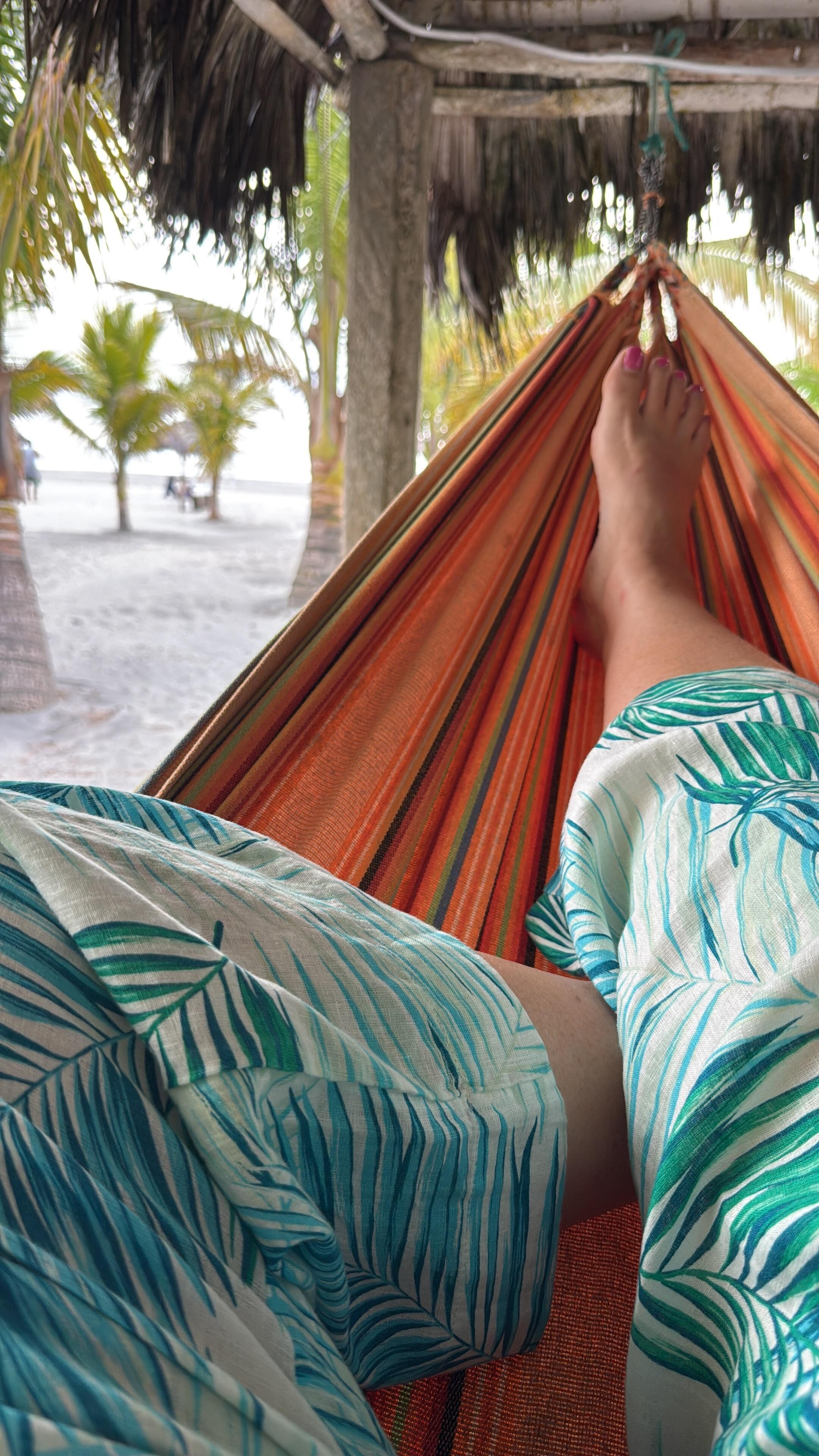Enjoying sunset from hammock on the beach