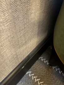 Dust next to sofa.