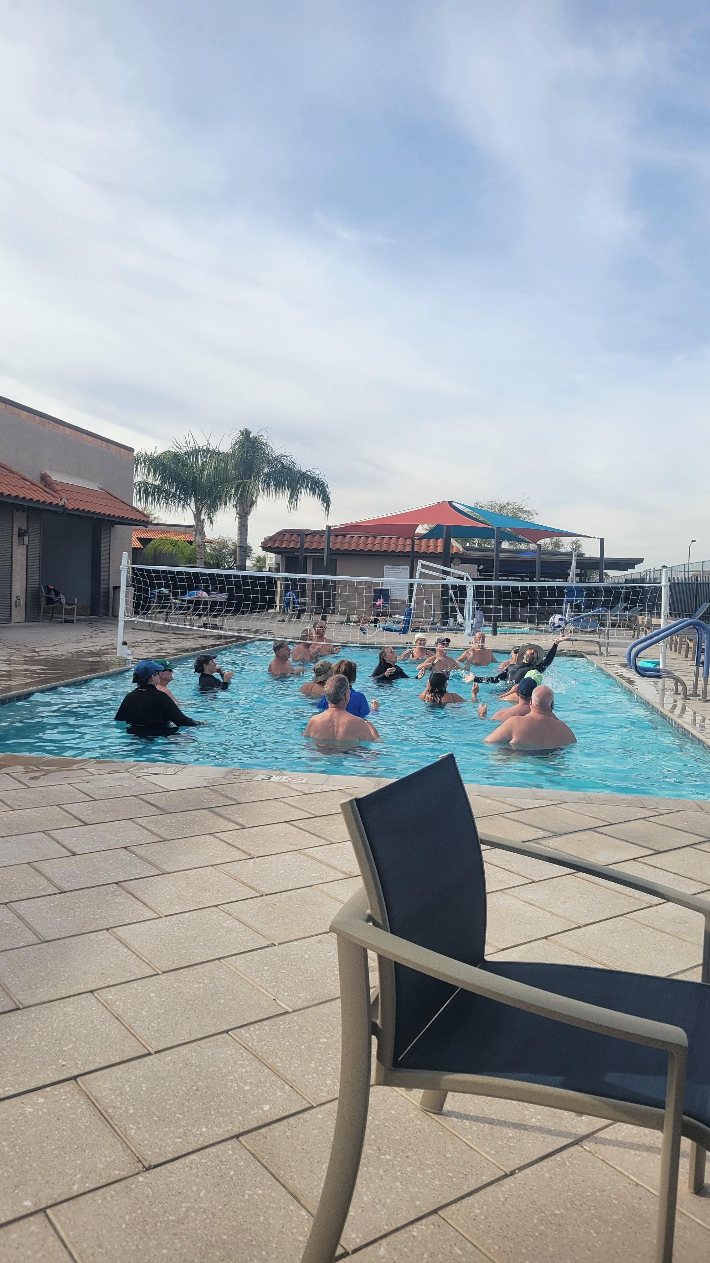 We were relaxing by pool after pickleball, watching these people enjoy water volleyball.  Everyone was having a great time.