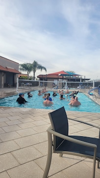 We were relaxing by pool after pickleball, watching these people enjoy water volleyball. Everyone was having a great time.