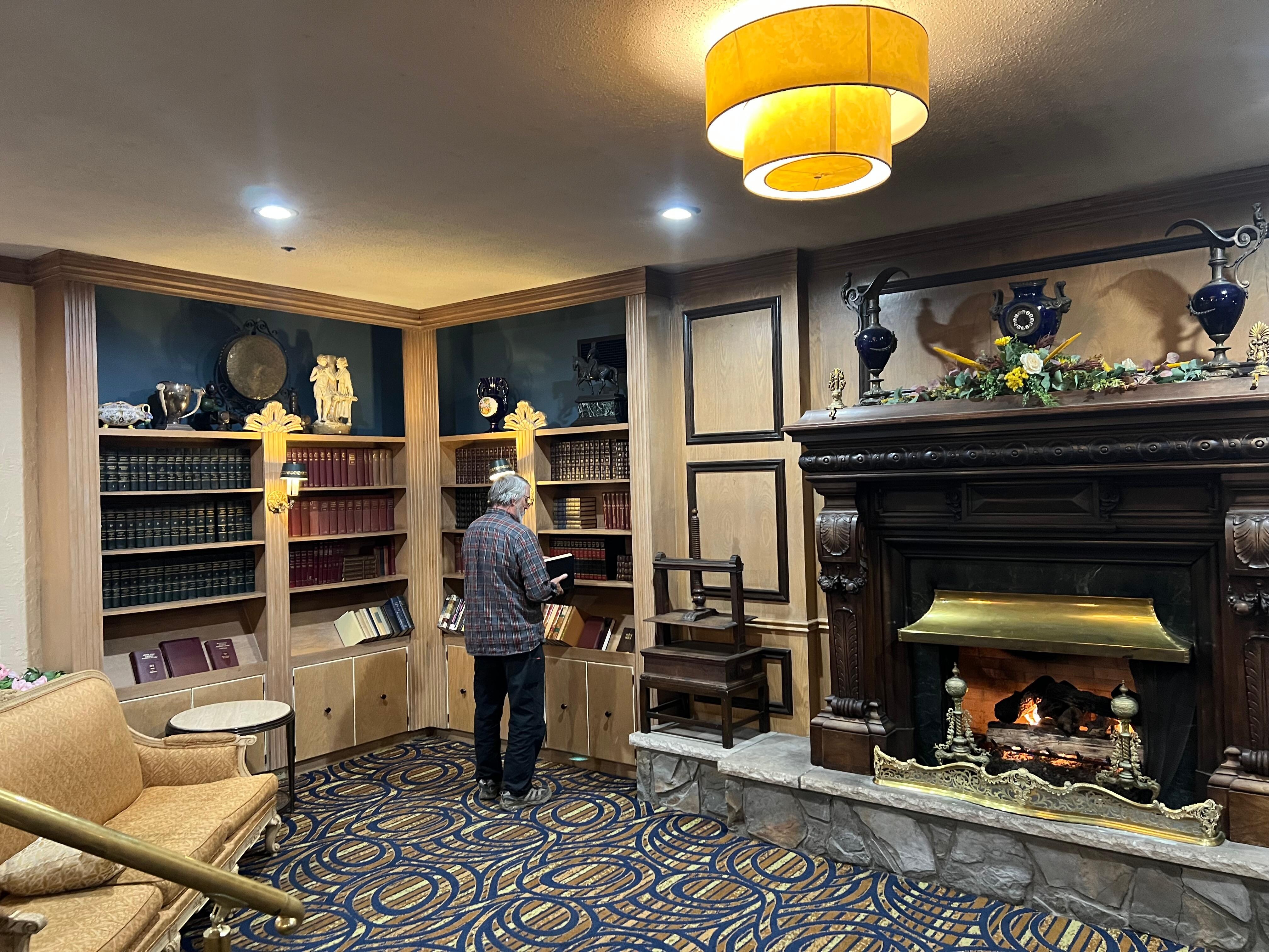A lovely sitting area with library & a grand fireplace off the lobby.