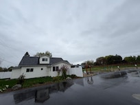 House surrounded by 3-4 vacant lots