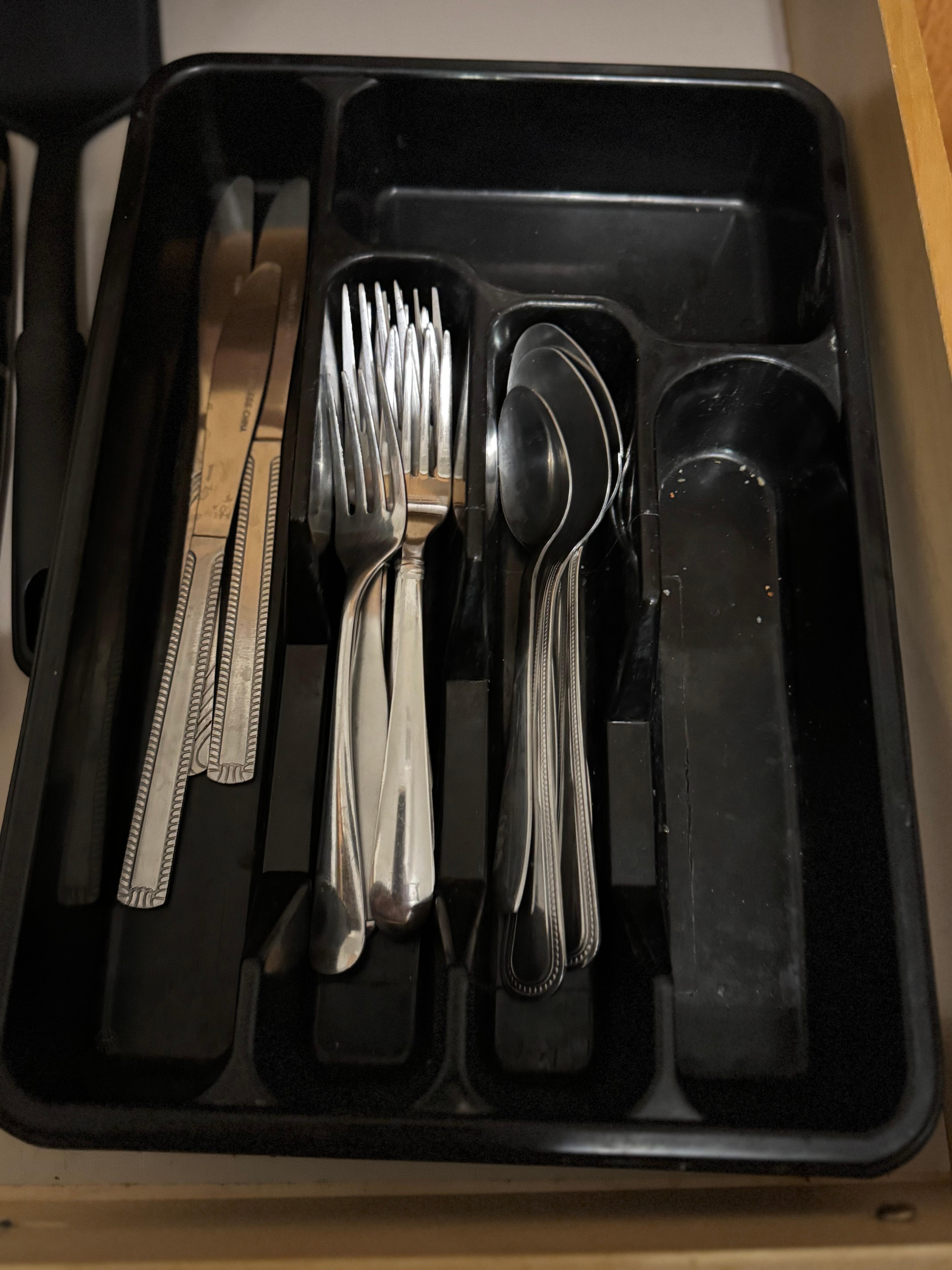 Dirty drawers with food crumbs in them.  