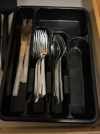 Dirty drawers with food crumbs in them.