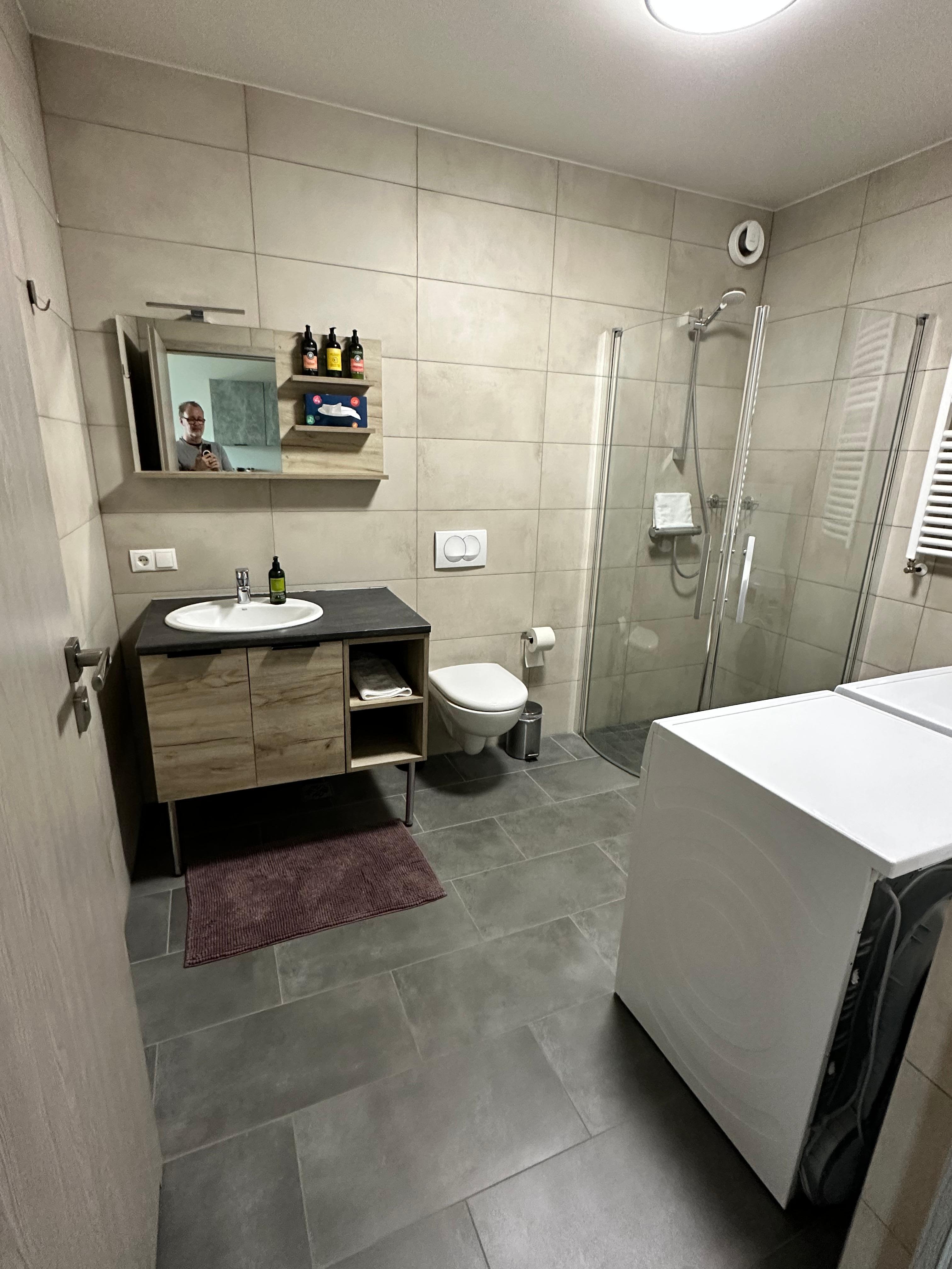 Bathroom with washer and dryer. 