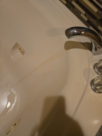 dirty bathtub which they never came back to clean