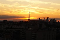 Sunset behind the Eiffel tower, taken from the balcony.