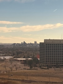 My view from my hotel room. Seeing downtown , railways .