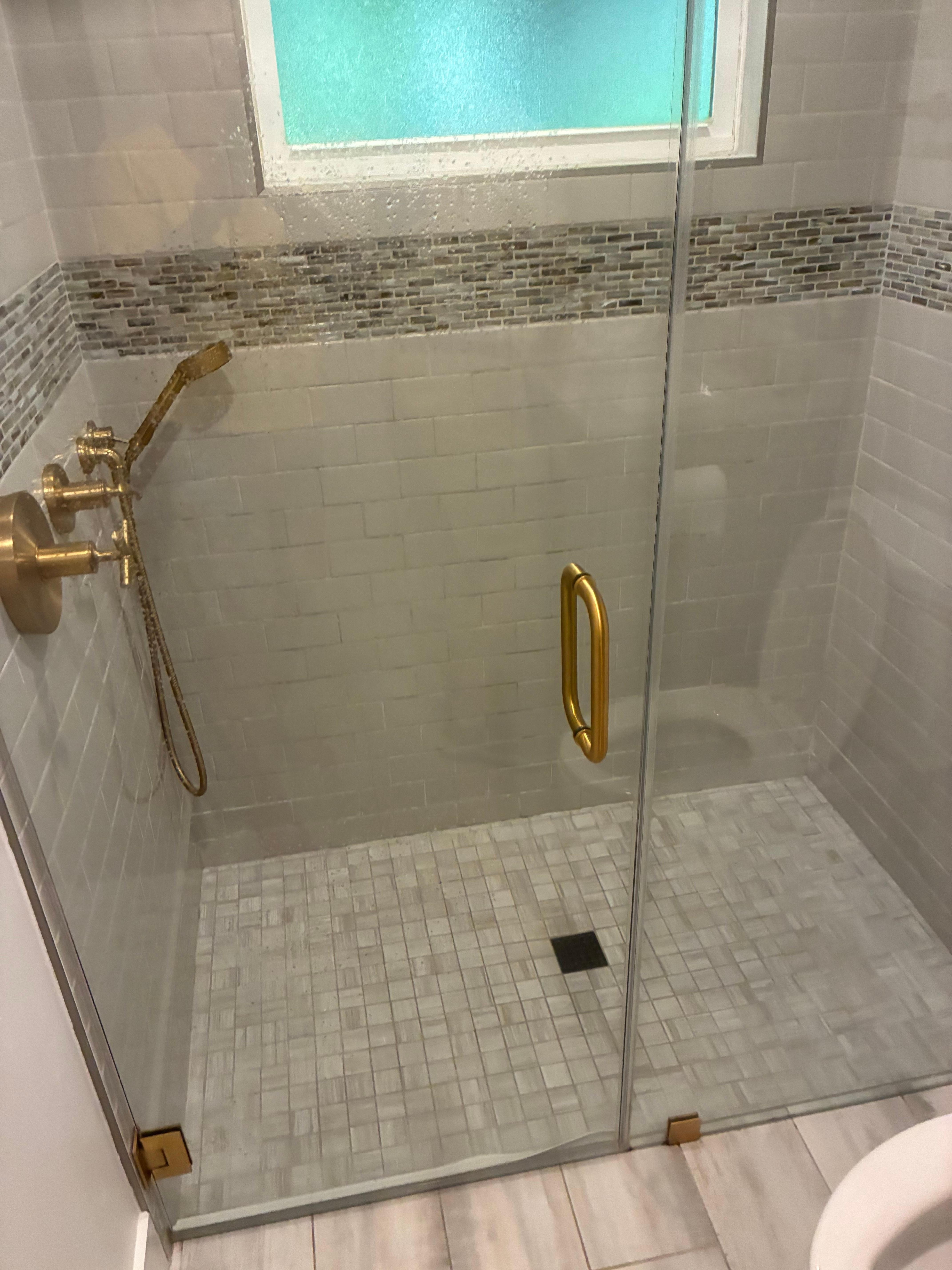 Bathroom low on privacy, and shower door drags on the floor