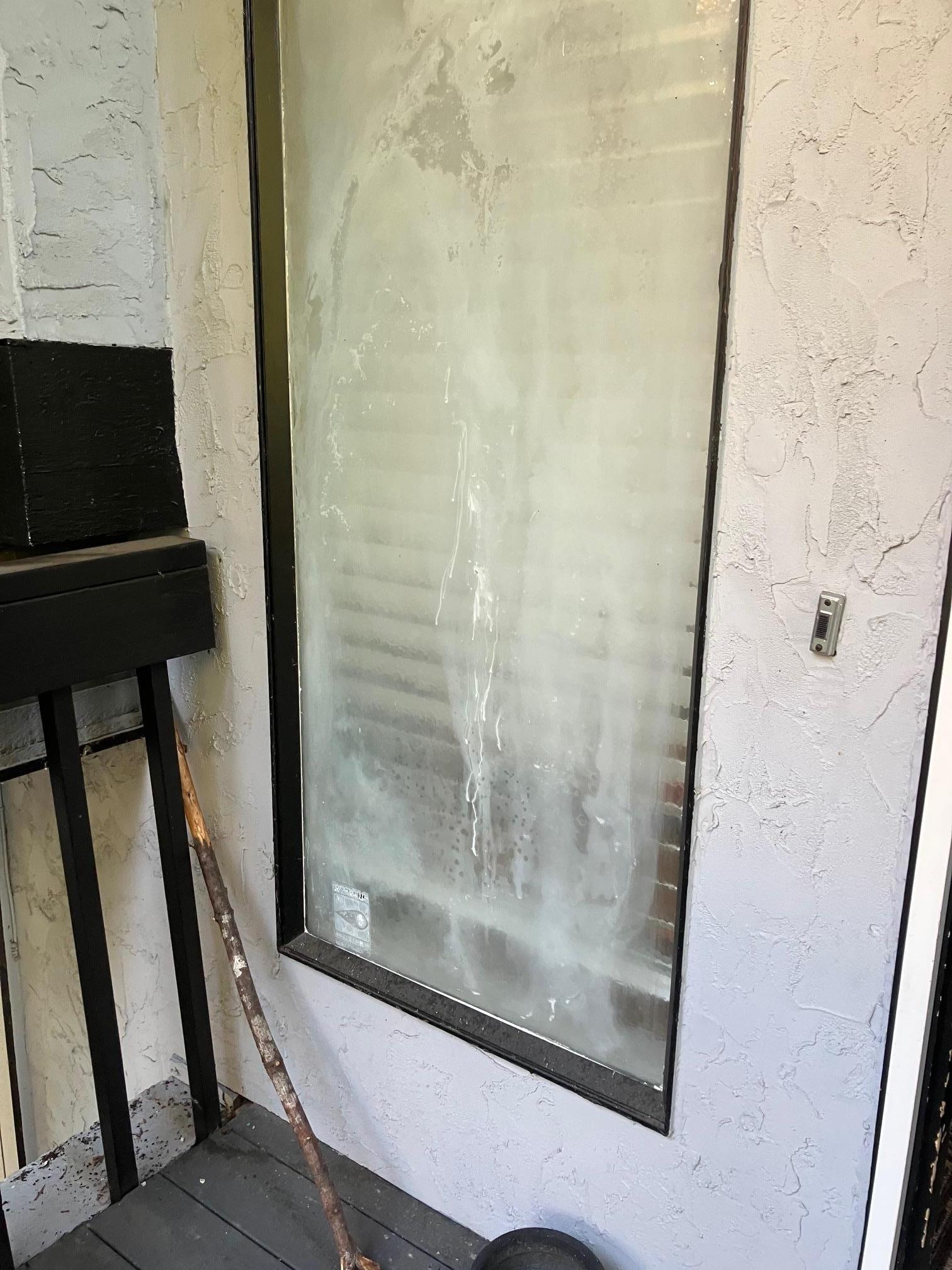 Window with broken seal at front door