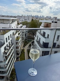 Rooftop Bar and Restaurant view is to a residential building