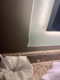 The whole mirror was busted this is the only picture I had though. Seems dangerous to me. Broken glass.