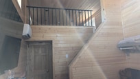 looking up at the loft with two twin matresses on the floor