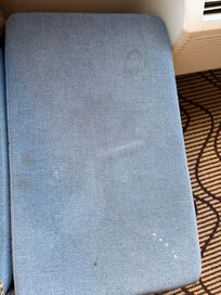 Heavily stained upholstery.