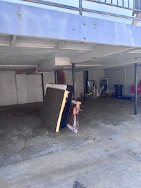 dirty mattresses and garbage in the parking area