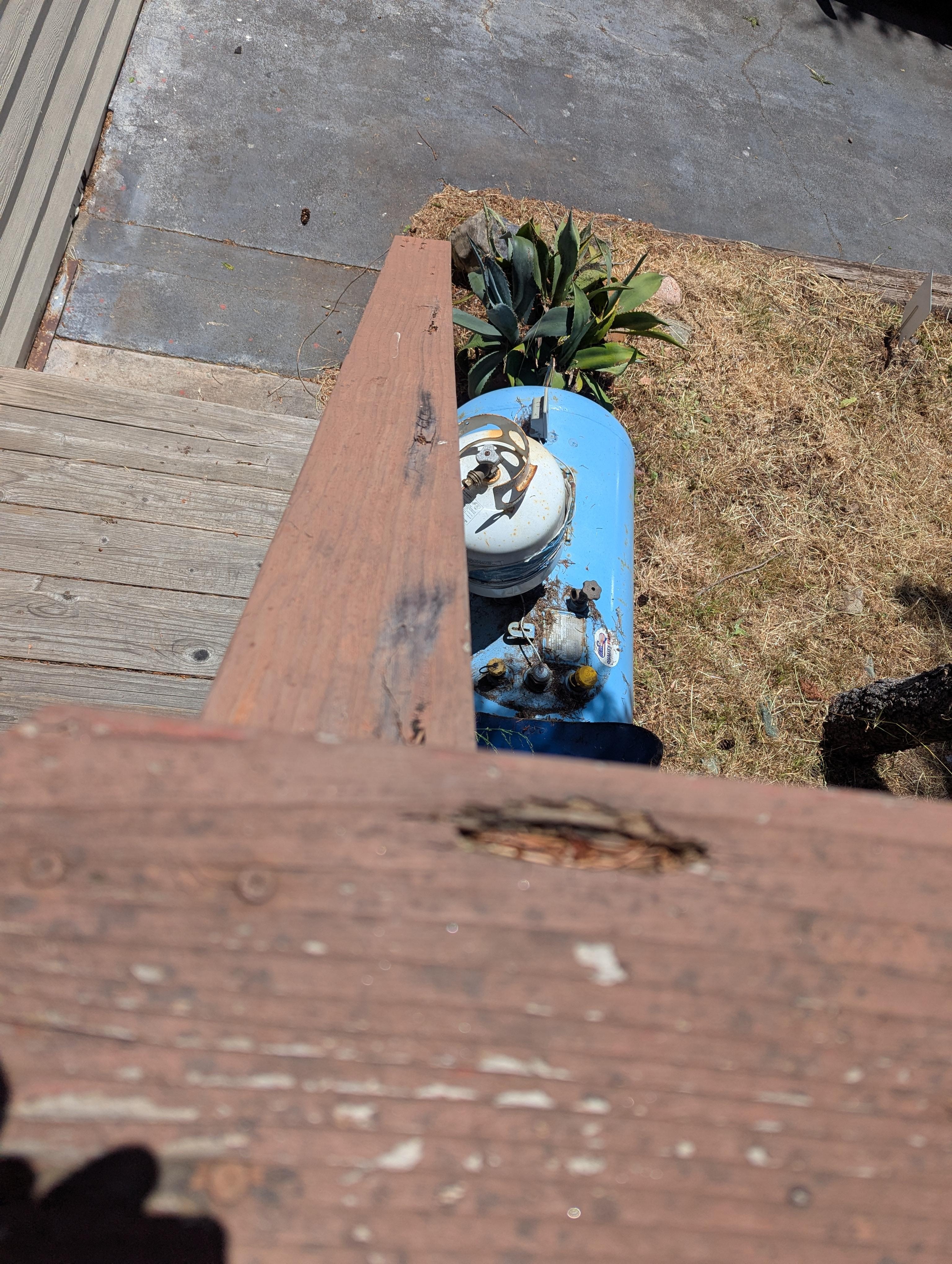 Rotten railing that came off in my hand ( I pushed it back).  Newel post also rotten and loose.  