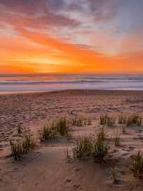 The beach at sunrise. Steps from the deck.