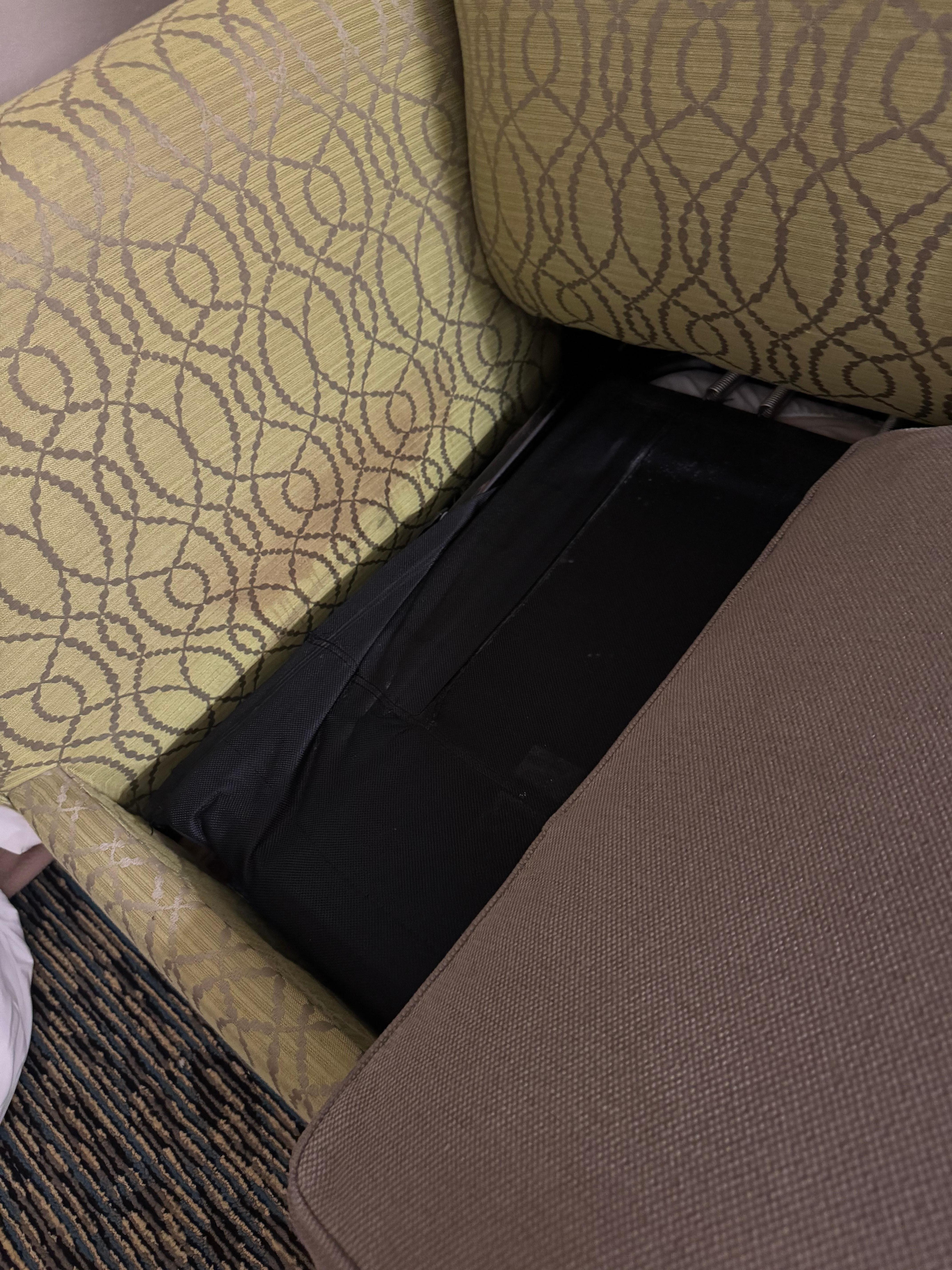 Staining down side of grubby, smelly couch