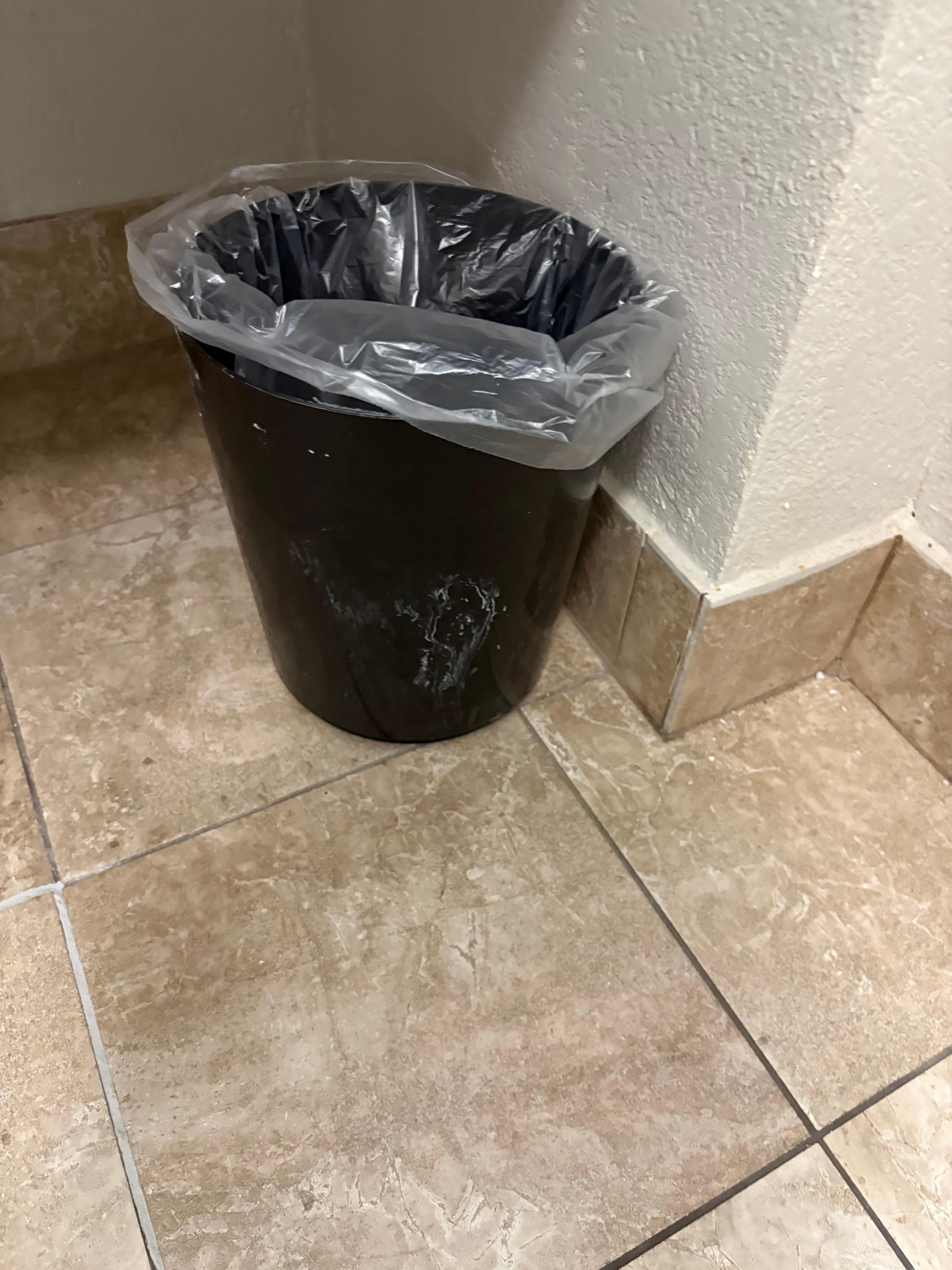 Something all over garbage can & tissue holder