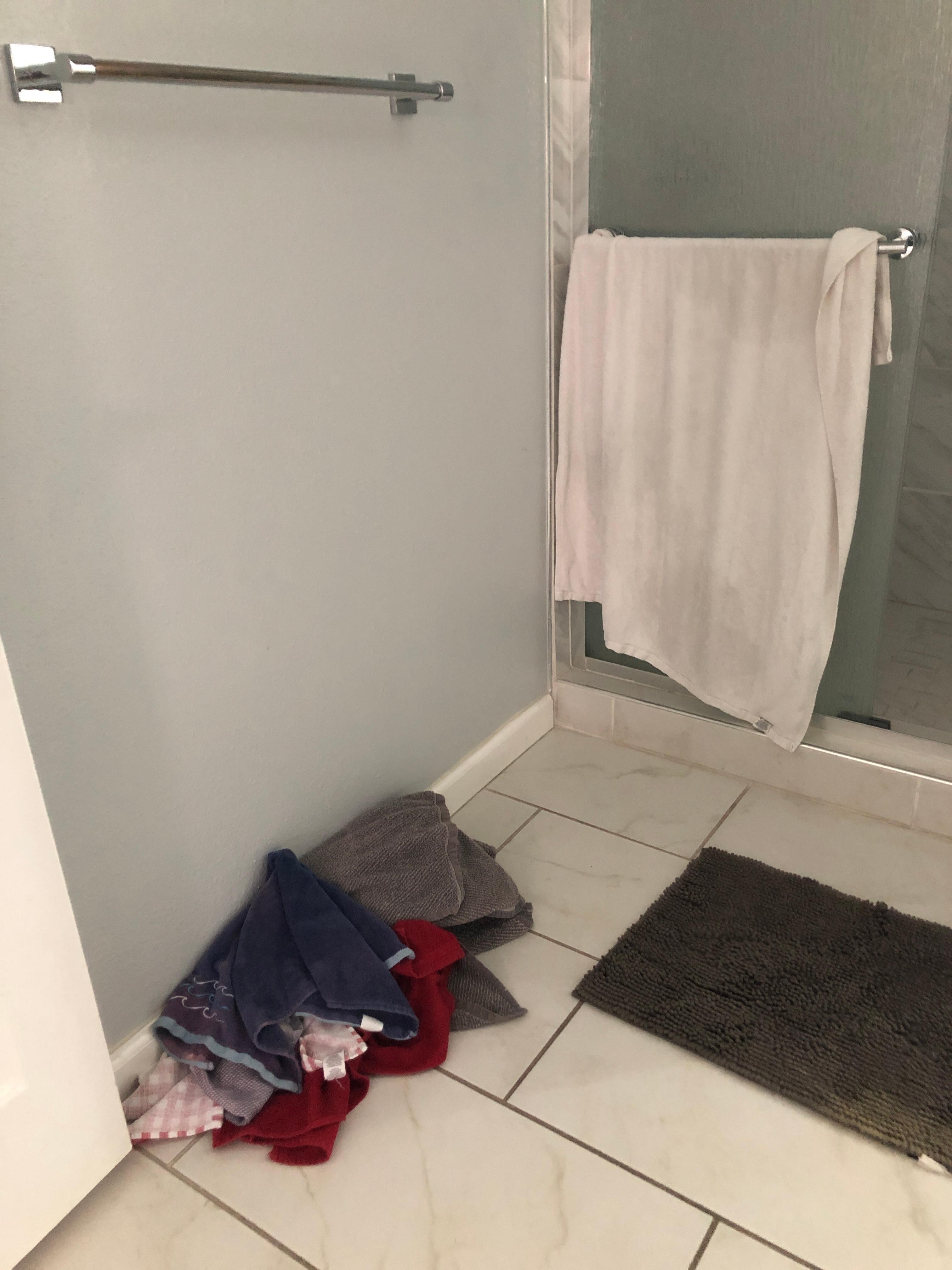 Dirty towels on the floor, no clean towels 
