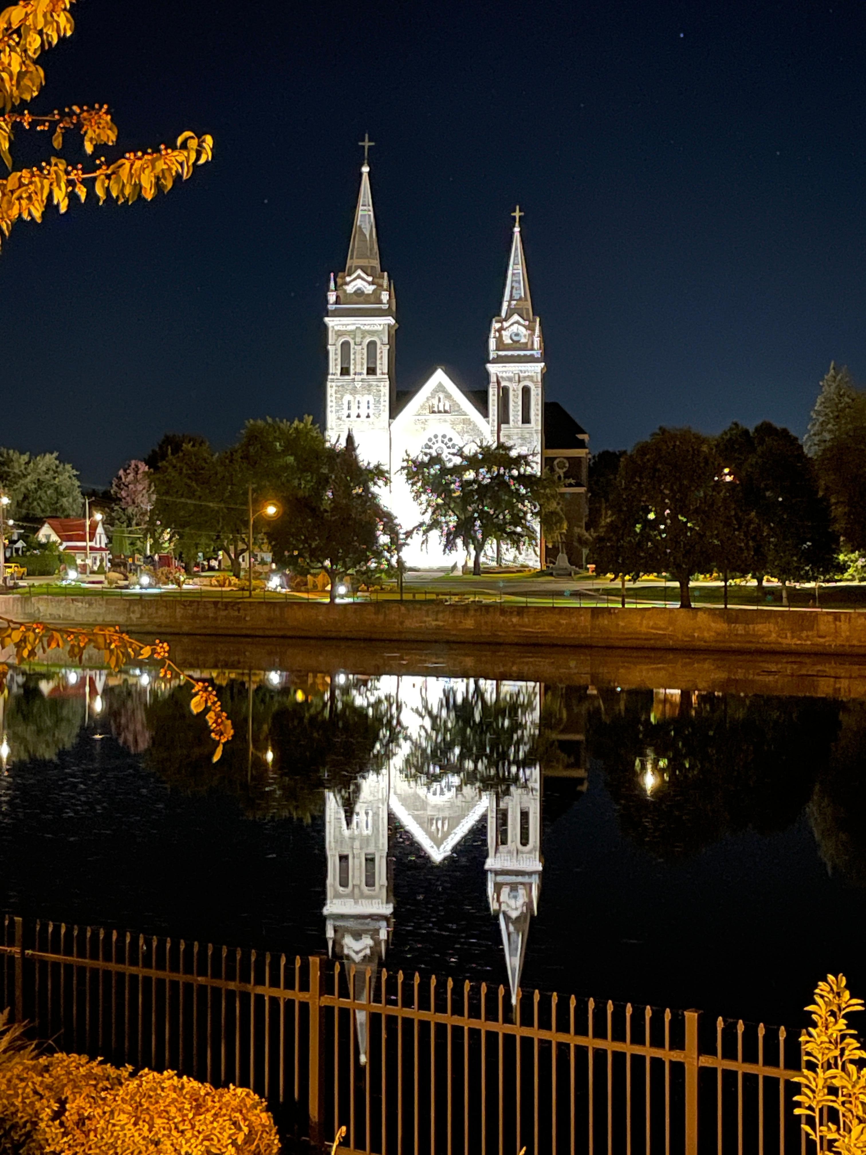 The church lit up at night 