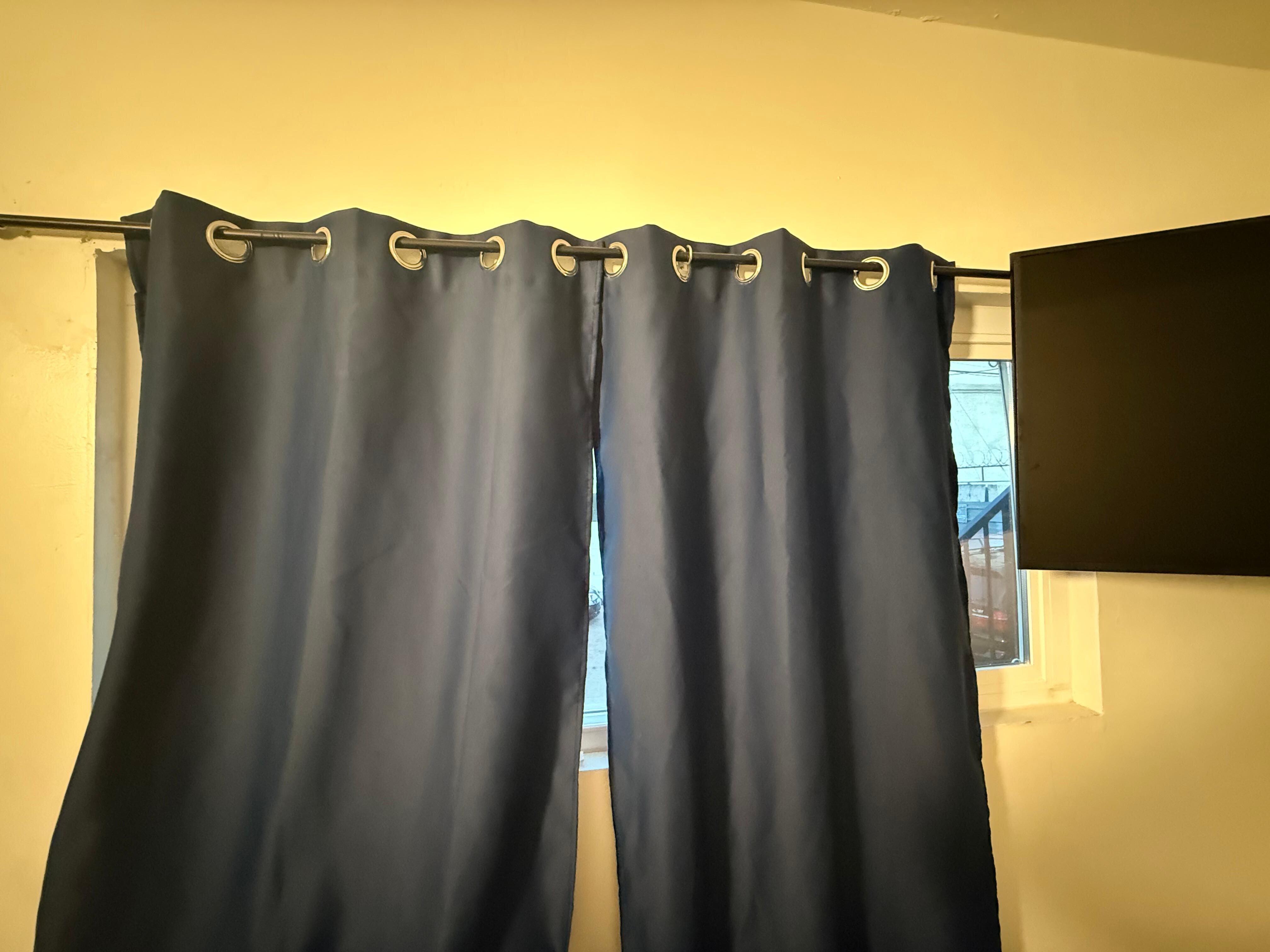 Curtains don’t cover frame. Can see in from outside.