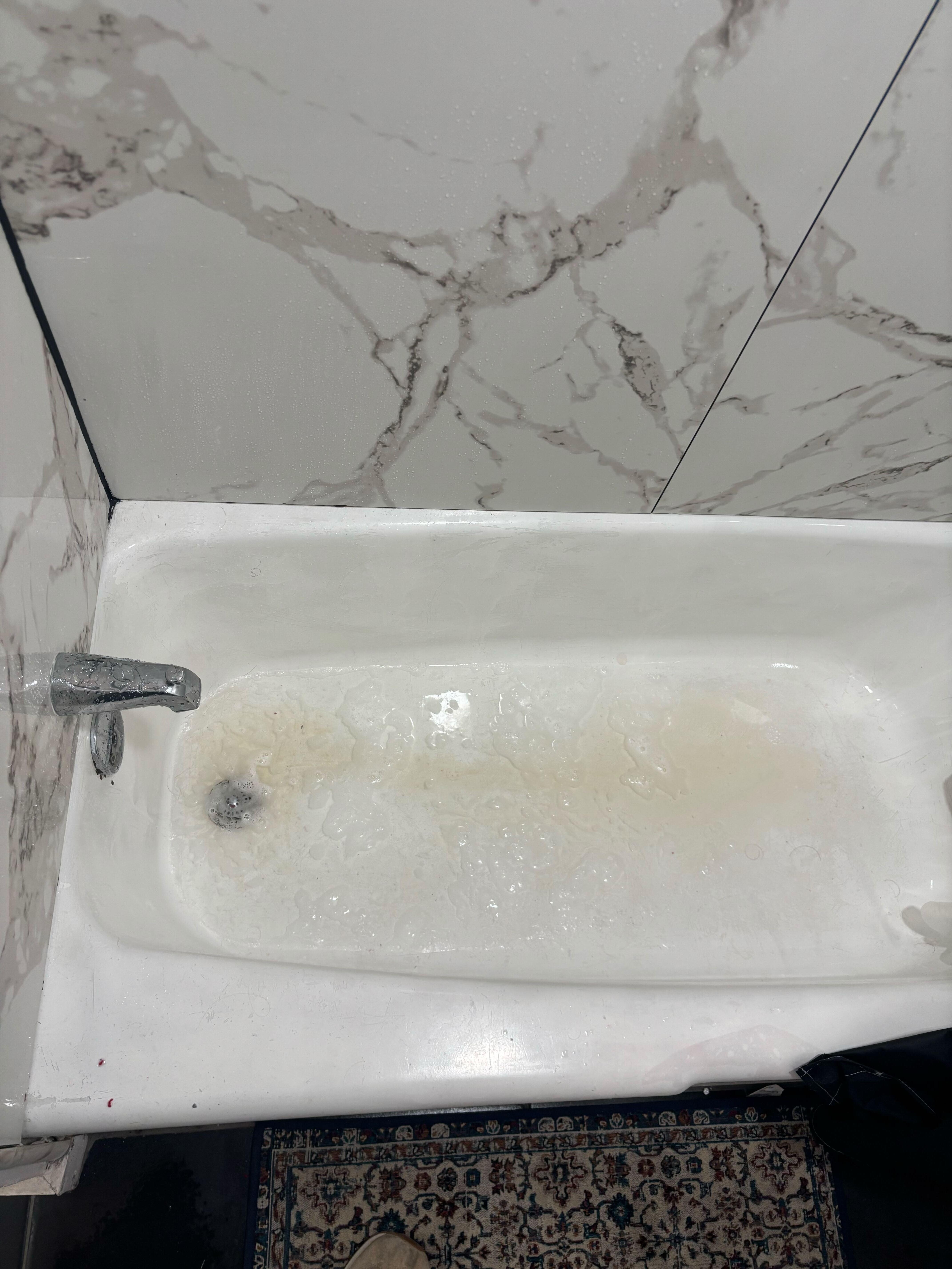 Nasty bathwater that wasn't drained from the last person using it 