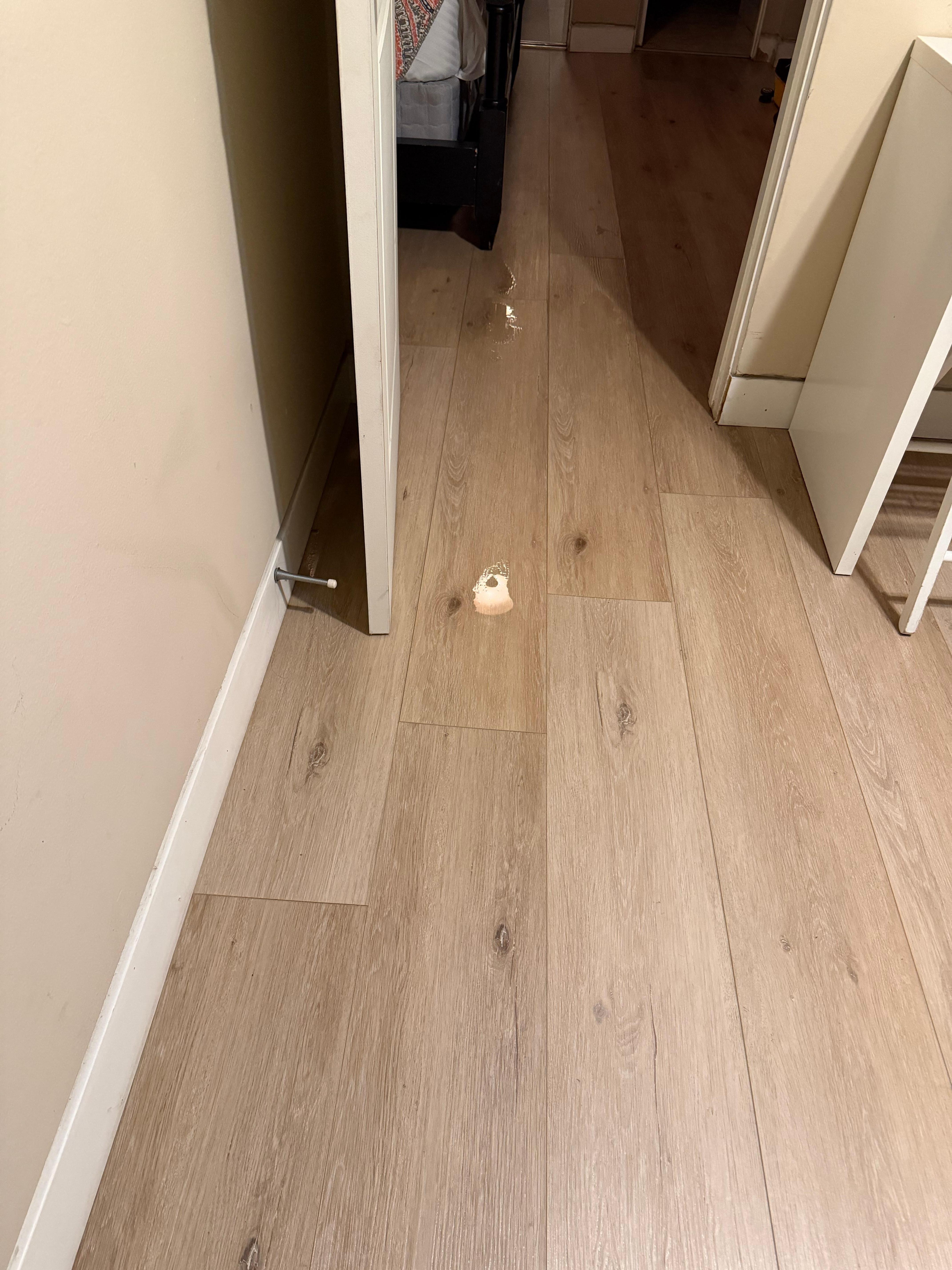Water on the floor going into the master bedroom