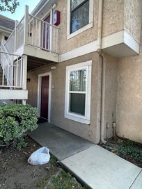 Food container & trash in front of the door- zoom in to see quality of exterior